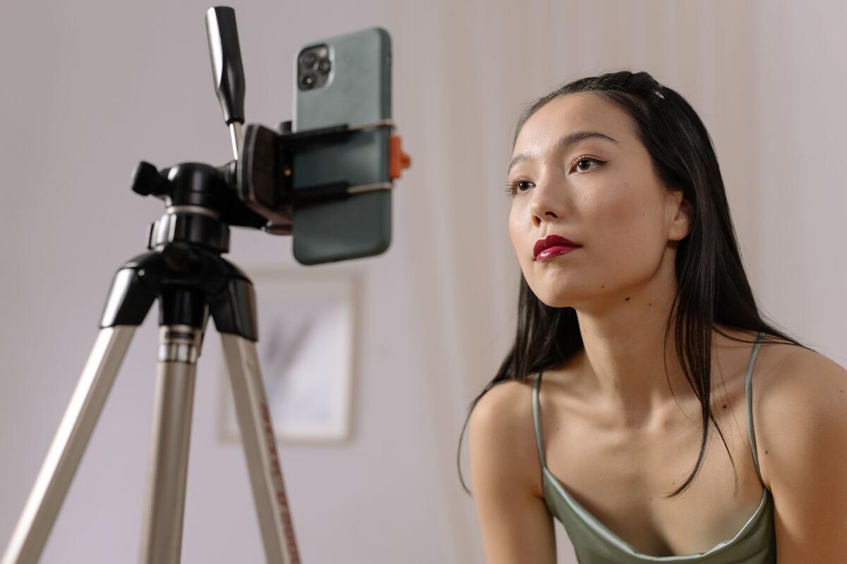 Creator filming a product review on a phone — JIAHE influencer marketing